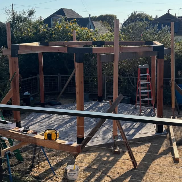 Hexagonal timber pergola structure during construction
