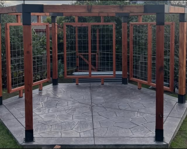 Completed timber pergola over a stamped concrete patio