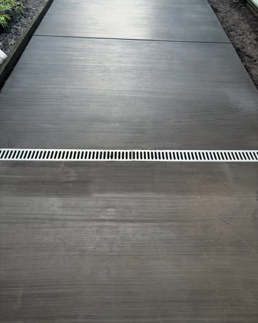 Finished concrete slab with an integrated channel drain